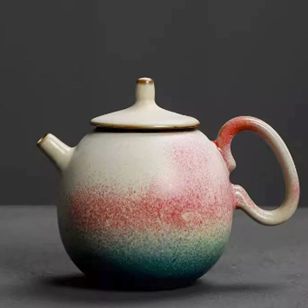 Longdan rainbow glaze ceramic teapot with a loop handle on a dark gray background