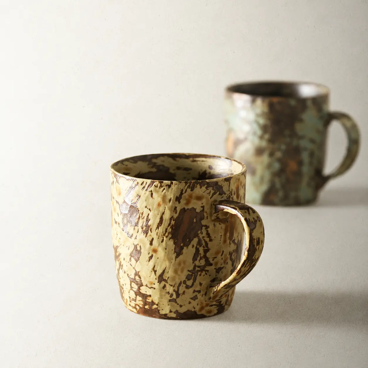 Mango Yellow and Mint Green color options of the handmade reactive glaze ceramic coffee mug
