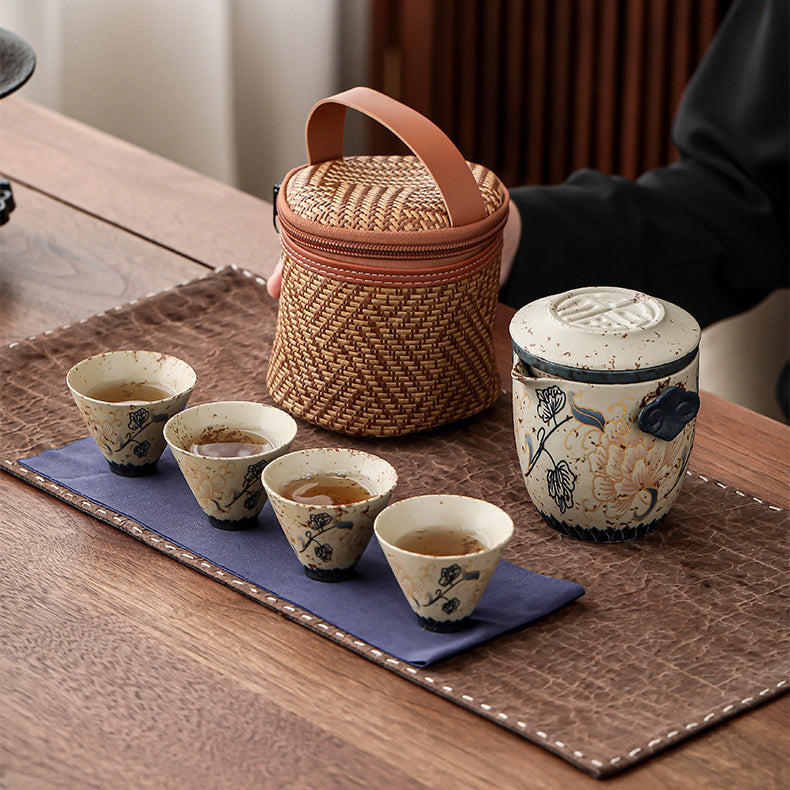 Peony ceramic travel tea set with teapot, four cups, tea cloth, and carrying case
