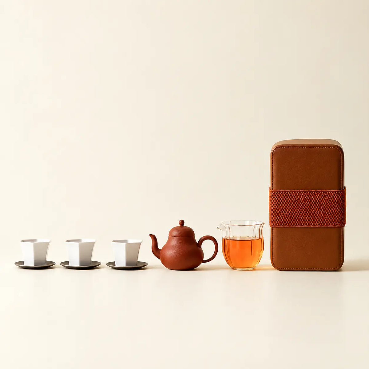 Portable zisha gongfu tea set with teapot, glass fairness pitcher, three cups, coasters, and travel case
