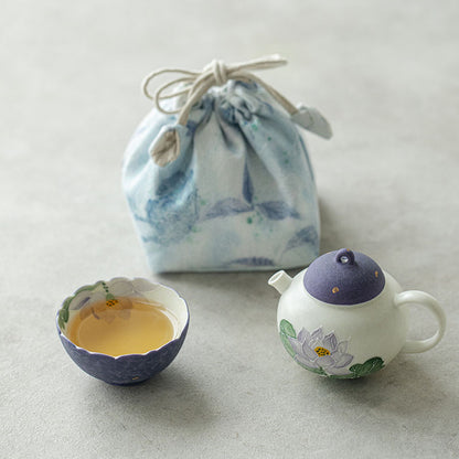 Hand-painted purple lotus ceramic travel tea set for one with teapot, flower-rim cup, and drawstring pouch