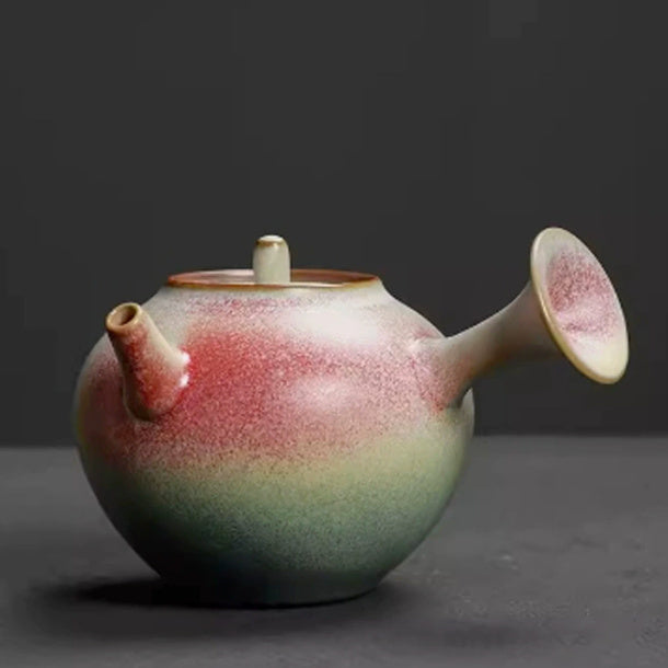 Side-handle rainbow glaze ceramic teapot on a dark gray background