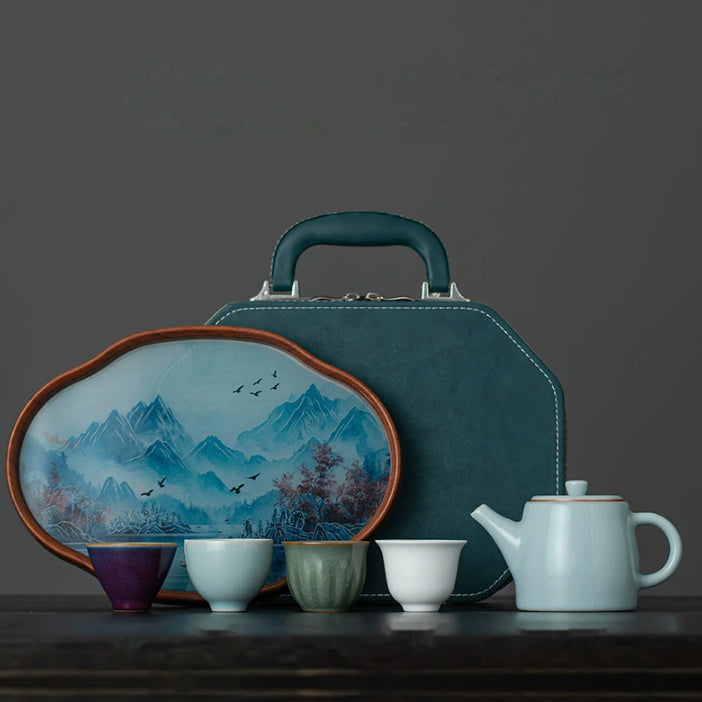 Fangyuan ceramic teapot with four kiln-inspired tasting cups, a landscape tea tray, and fitted travel case
