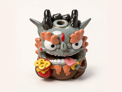 Front view of the Fortune ceramic Pixiu incense holder with a red money pouch