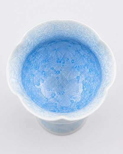 Top view of a pale blue crystalline glaze tea cup showing crystal patterns inside