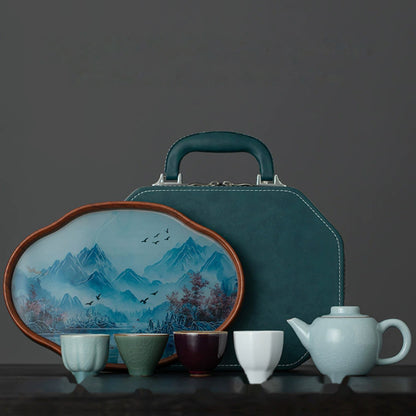 Flat-Top ceramic teapot with four kiln-inspired tasting cups, a landscape tea tray, and fitted travel case
