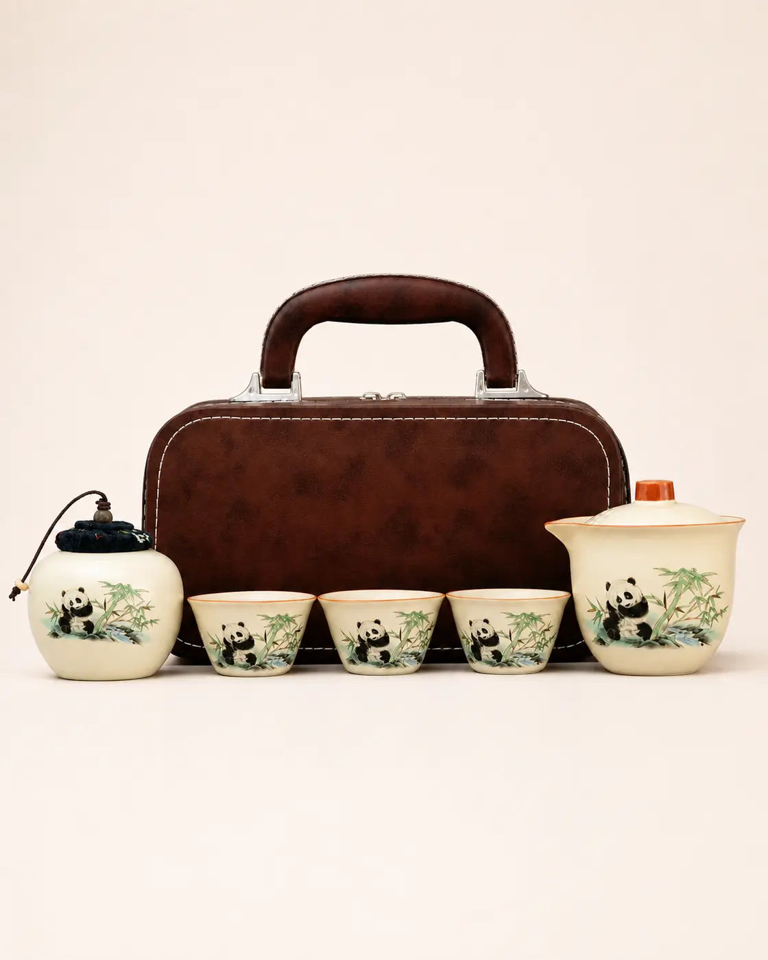Long-trip panda ceramic tea set with teapot, three cups, tea caddy and brown carrying case