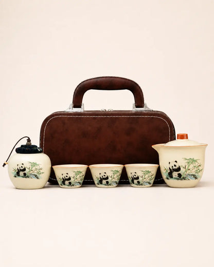 Long-trip panda ceramic tea set with teapot, three cups, tea caddy and brown carrying case