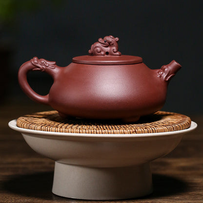 Reverse side of the Yixing zini clay teapot showing the sculpted dragon spout and handle