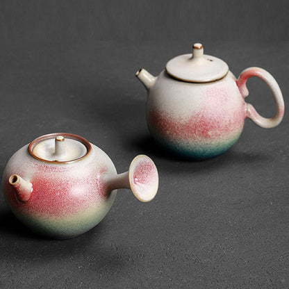 Side-handle and Longdan rainbow glaze ceramic teapots displayed together