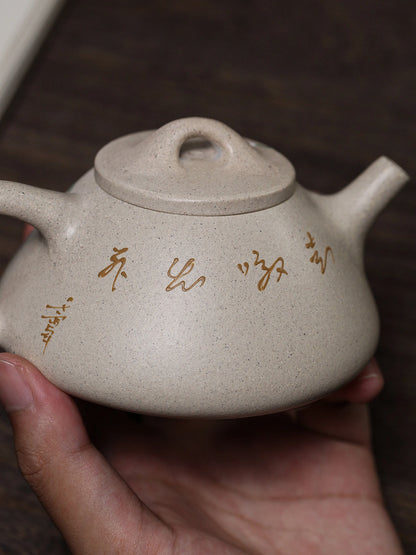 Handheld calligraphy side of the white duanni Yixing teapot