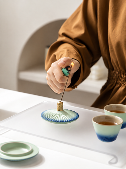 Palace-roof-inspired ceramic lid used as an incense holder
