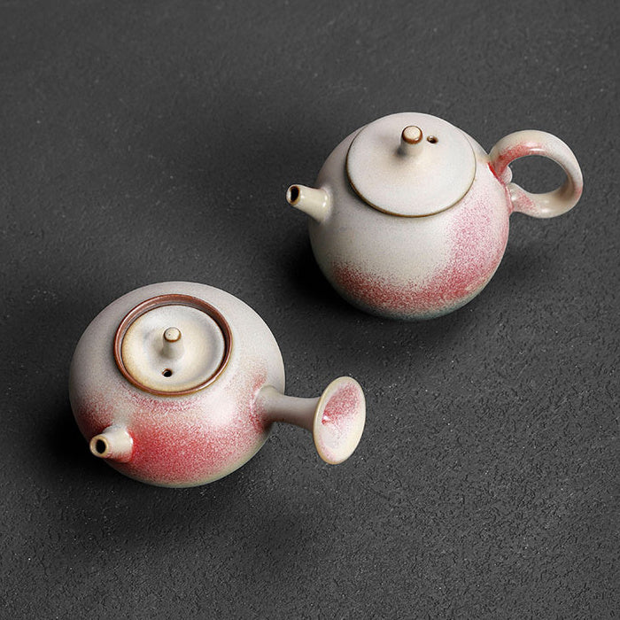 Overhead view of two handmade rainbow glaze ceramic teapots