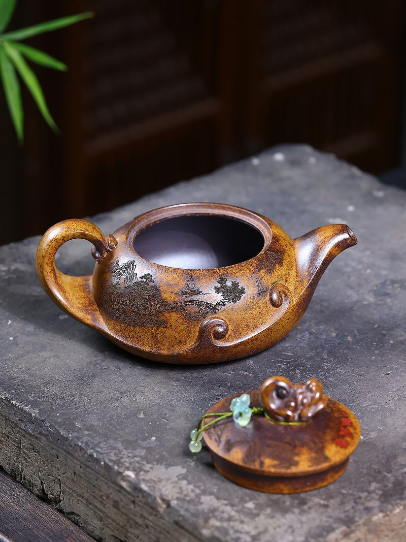 Yixing zisha teapot with the lid removed, showing the open interior and carved wood-fired exterior
