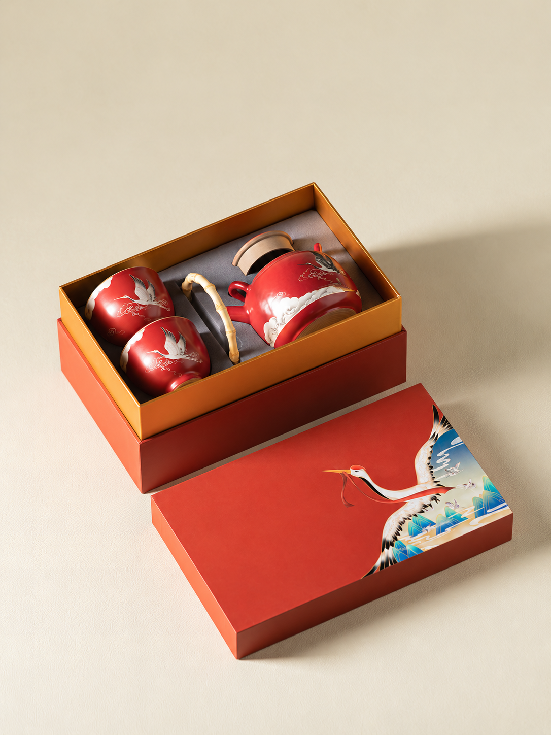Chinese red crane tea set arranged inside its fitted gift box
