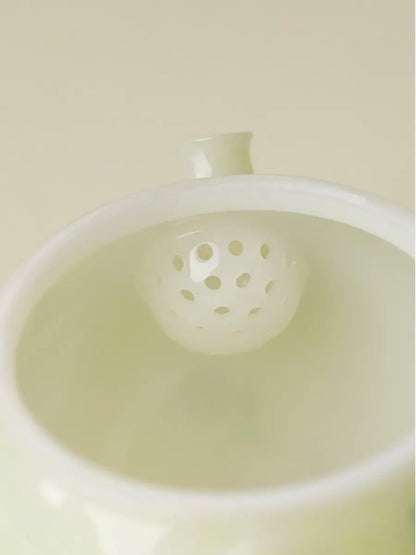 Close-up of the honeycomb-style ceramic filter holes inside the daisy teapot