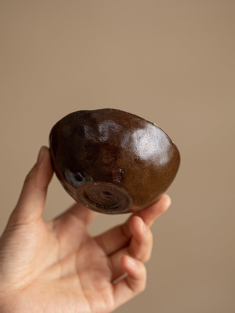 Base view of the handmade wood-fired ceramic lotus tea cup