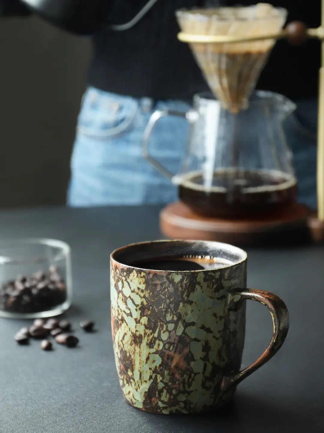 Mint Green reactive glaze ceramic coffee mug beside a pour-over coffee setup
