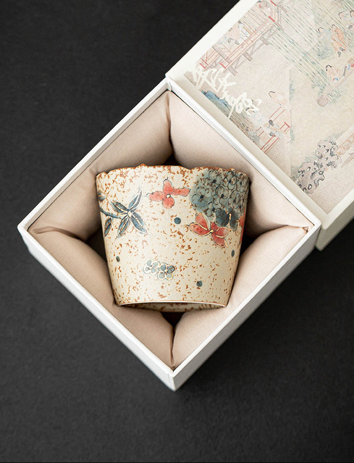 Hydrangea ceramic coffee cup displayed inside an example padded gift box; actual box style may vary