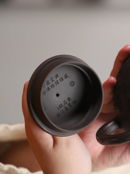 Underside of the teapot lid showing the interior inscription and stamped mark