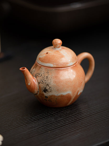 Close view of Liting handmade ceramic teapot on a dark tabletop