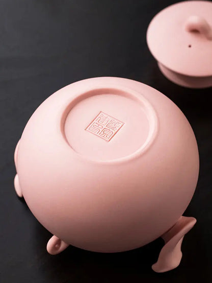 Underside of the handmade pink zisha teapot with maker’s mark
