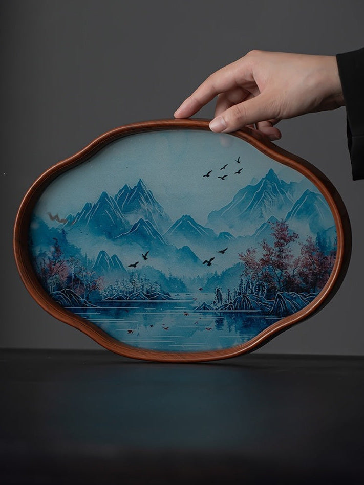 Bamboo-framed tea tray with an inlaid blue landscape glass base held upright
