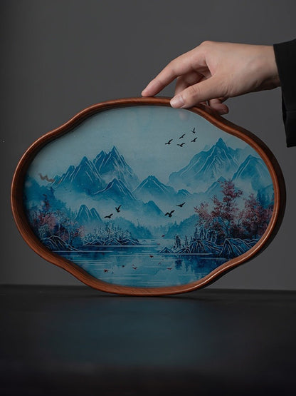 Bamboo-framed tea tray with an inlaid blue landscape glass base held upright
