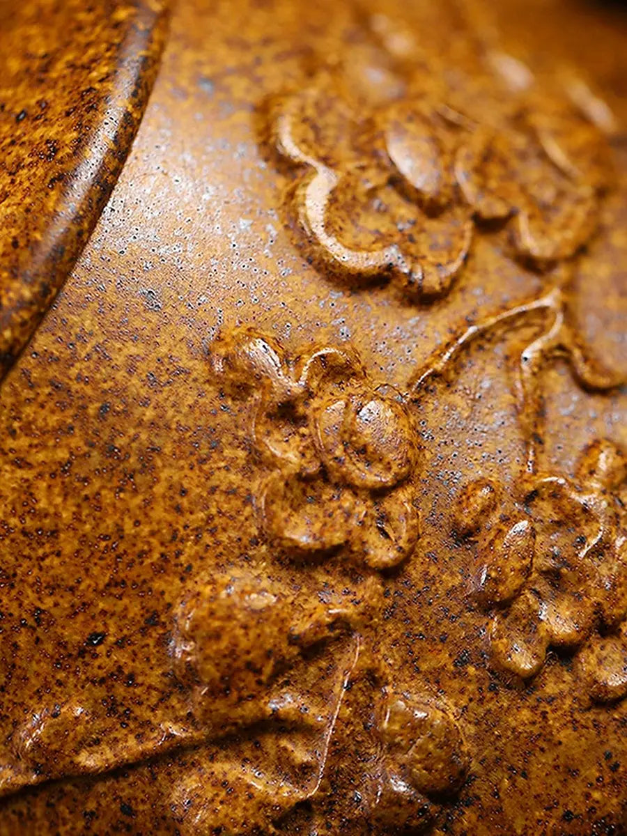Speckled Duanni zisha clay surface with raised plum blossom detail