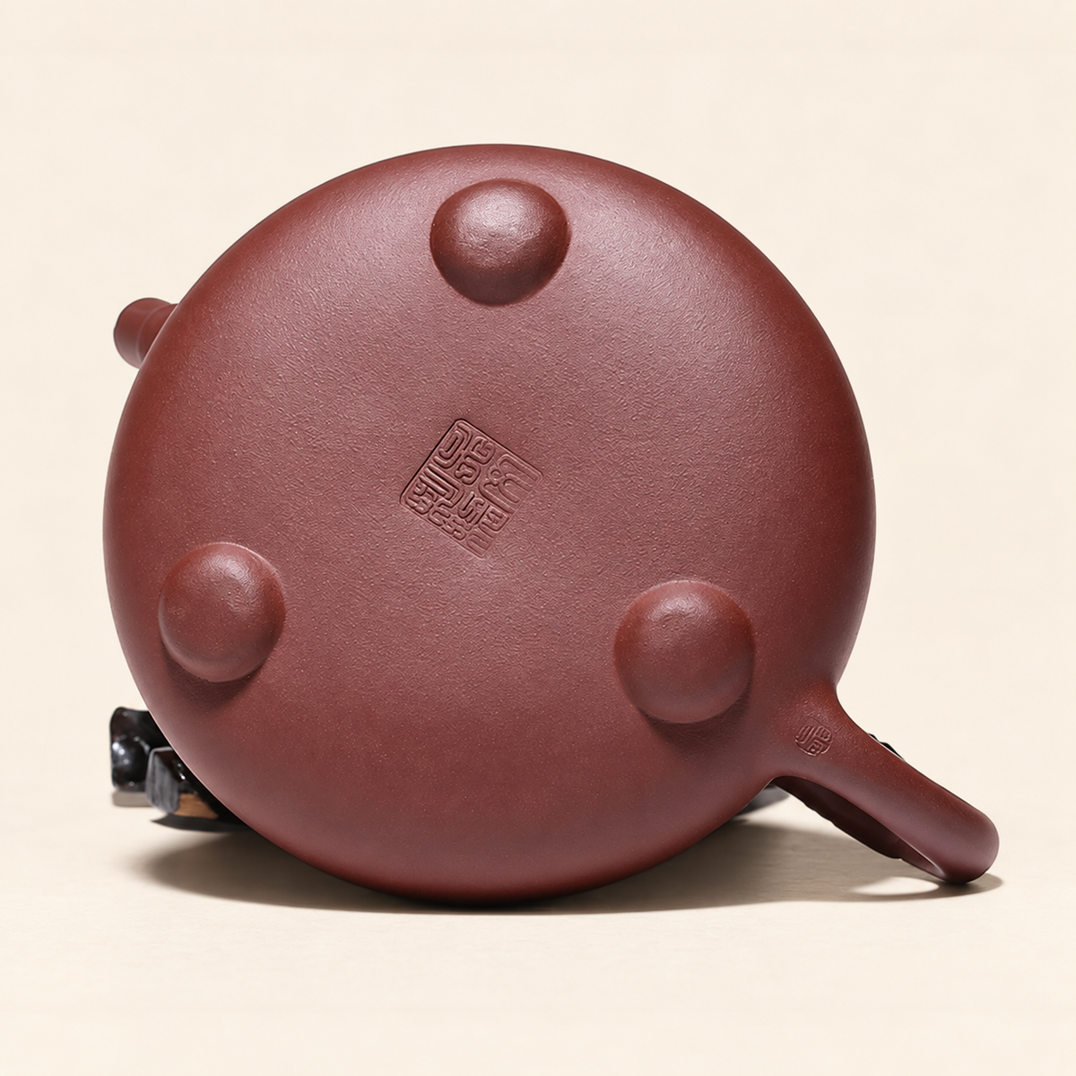 Bottom view of the Yixing Shi Piao teapot showing its three raised feet