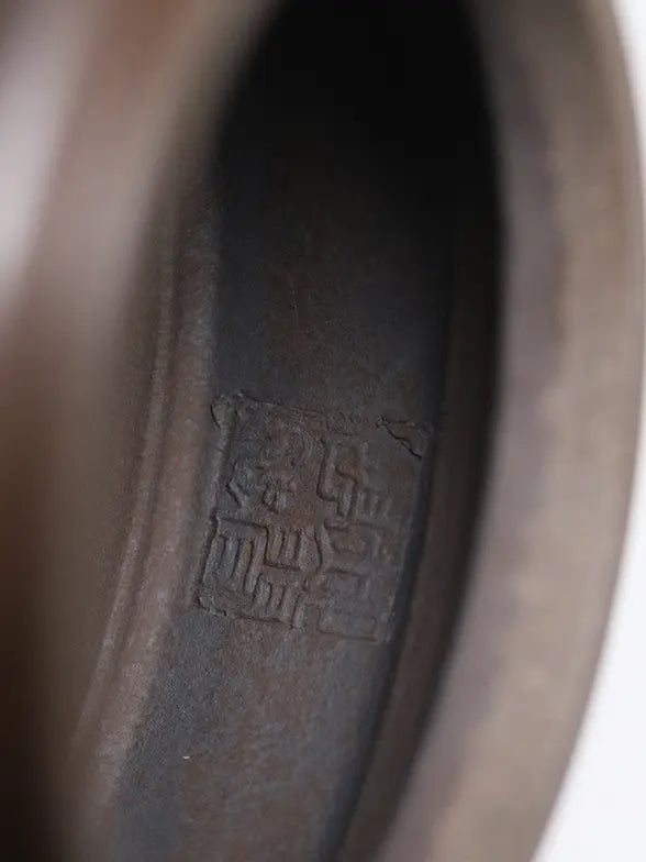 Close-up of the recessed maker's seal on the base of the zisha teapot