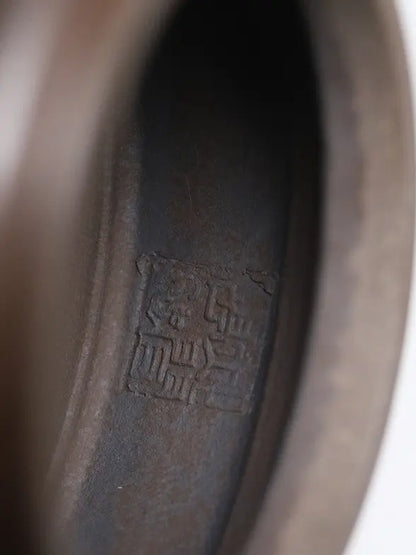 Close-up of the recessed maker's seal on the base of the zisha teapot