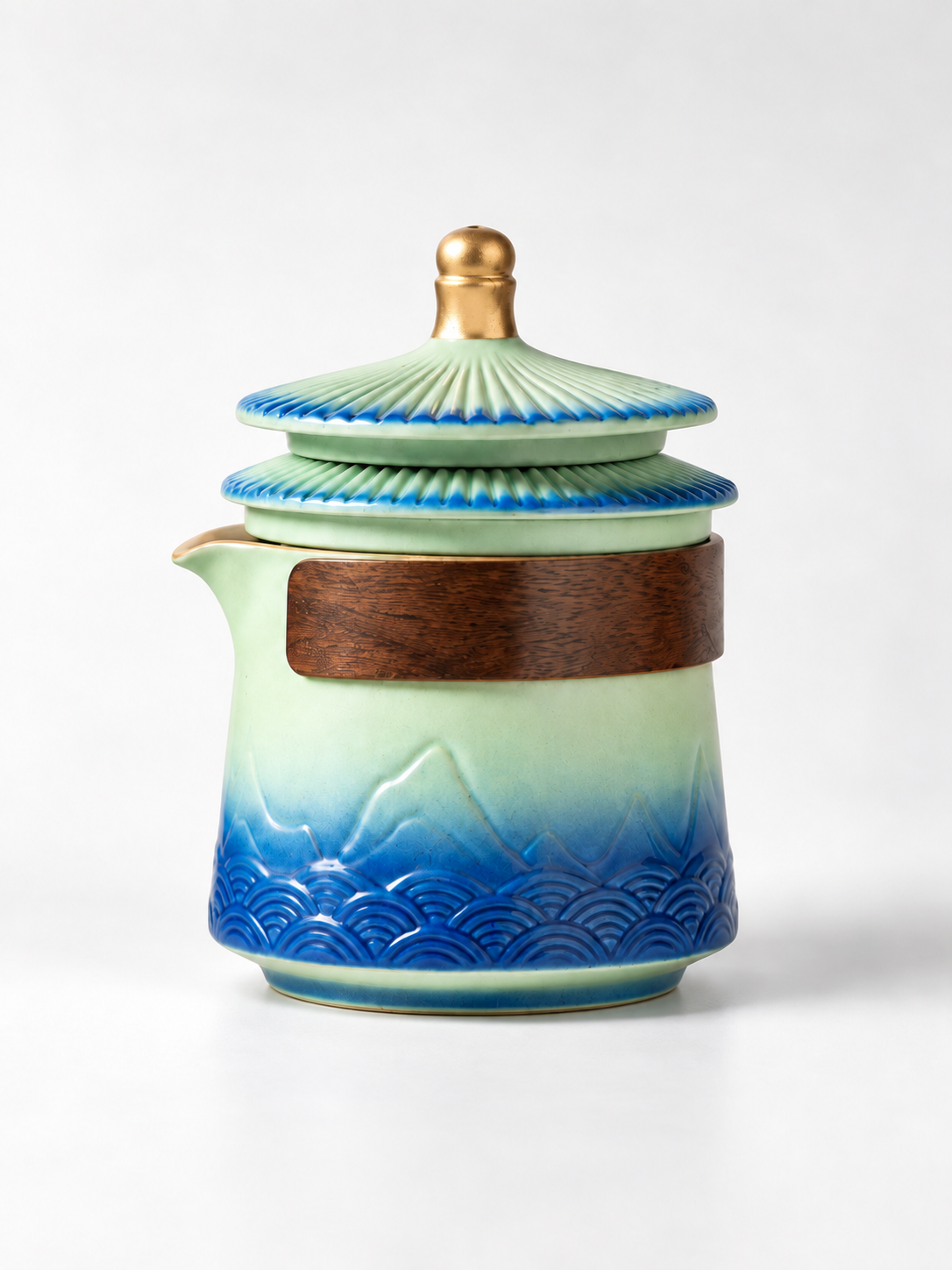 Palace-eaves ceramic teapot with green-blue mountain and wave design
