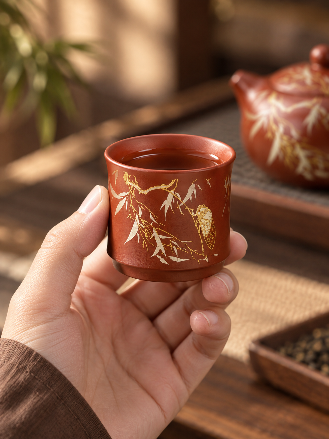 Matching zisha tea cup with bamboo and golden cicada decoration